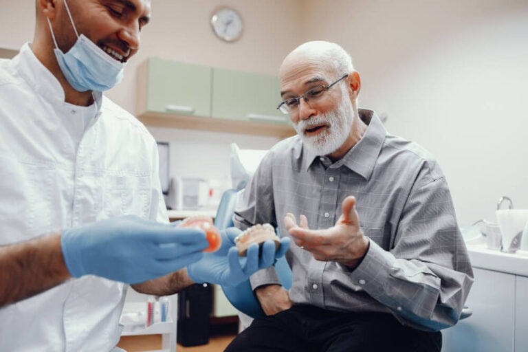 Dental implants Sydney consultation with senior patient
