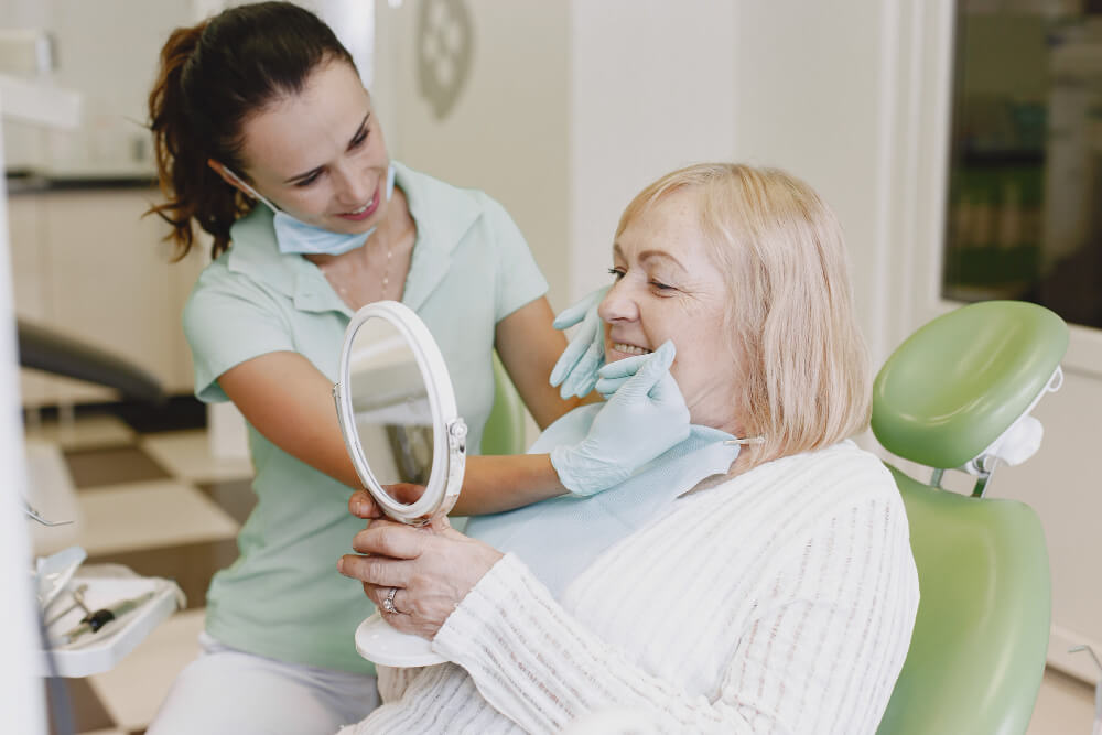 Old age patient asking dental implants Sydney guidelines from dentist
