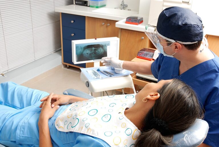 Dentist treating patient with dental implants in Sydney clinic